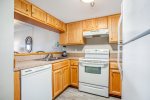 Fully Equipped Kitchen Open to Dining and Living 